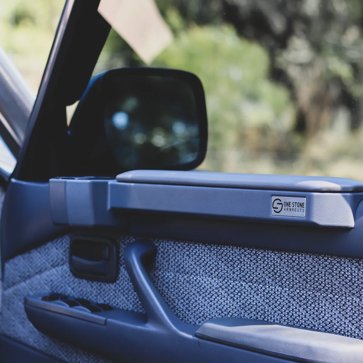 One Stone grey armrest and cupholder pair fitted in a Toyota LandCruiser 80 Series